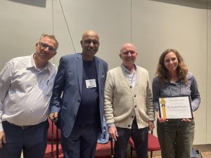 Thanos Papanicolaou, Teferi Tsygaye, Dan Roberts recognize Dr. Betsey Boughton with the LTAR Founder’s Award during the 2026 LTAR Annual Science Meeting in Ames, IA.